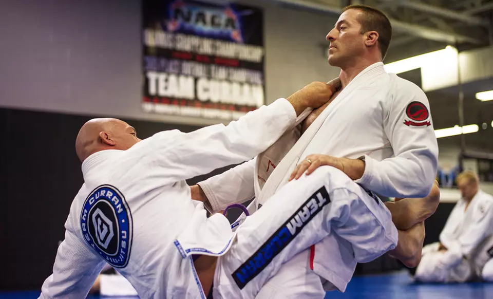 Kickboxing, Jiu-Jitsu, and Boxing Classes at Team Curran MMA Inc. (Up to 72% Off). Three Options Available.  - Primary Image
