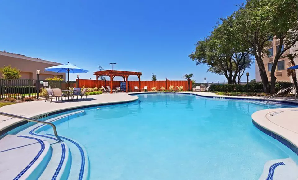 Stay with Optional Breakfast at Holiday Inn Bedford DFW Airport Area West near Fort Worth, TX. Dates into August. - Primary Image