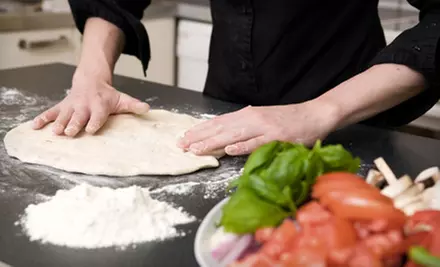 One or Two Large Pizzas with Two or Four Soft Drinks at The Ticket Eatery (Half Off) - Primary Image