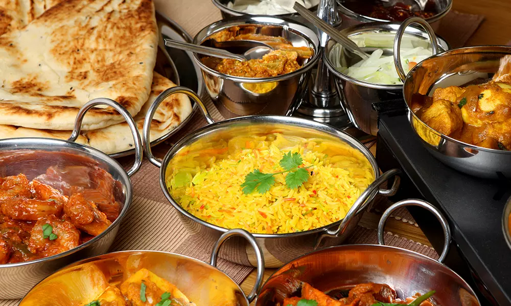 Indian Cuisine at Taj Indian Restaurant (Up to 39% Off). Two Options Available. - Primary Image