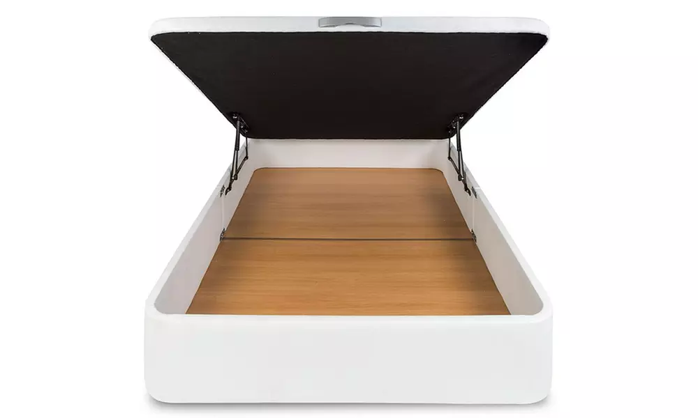 Canapé tapizado en polipiel de color blanco, con colchón y almohada