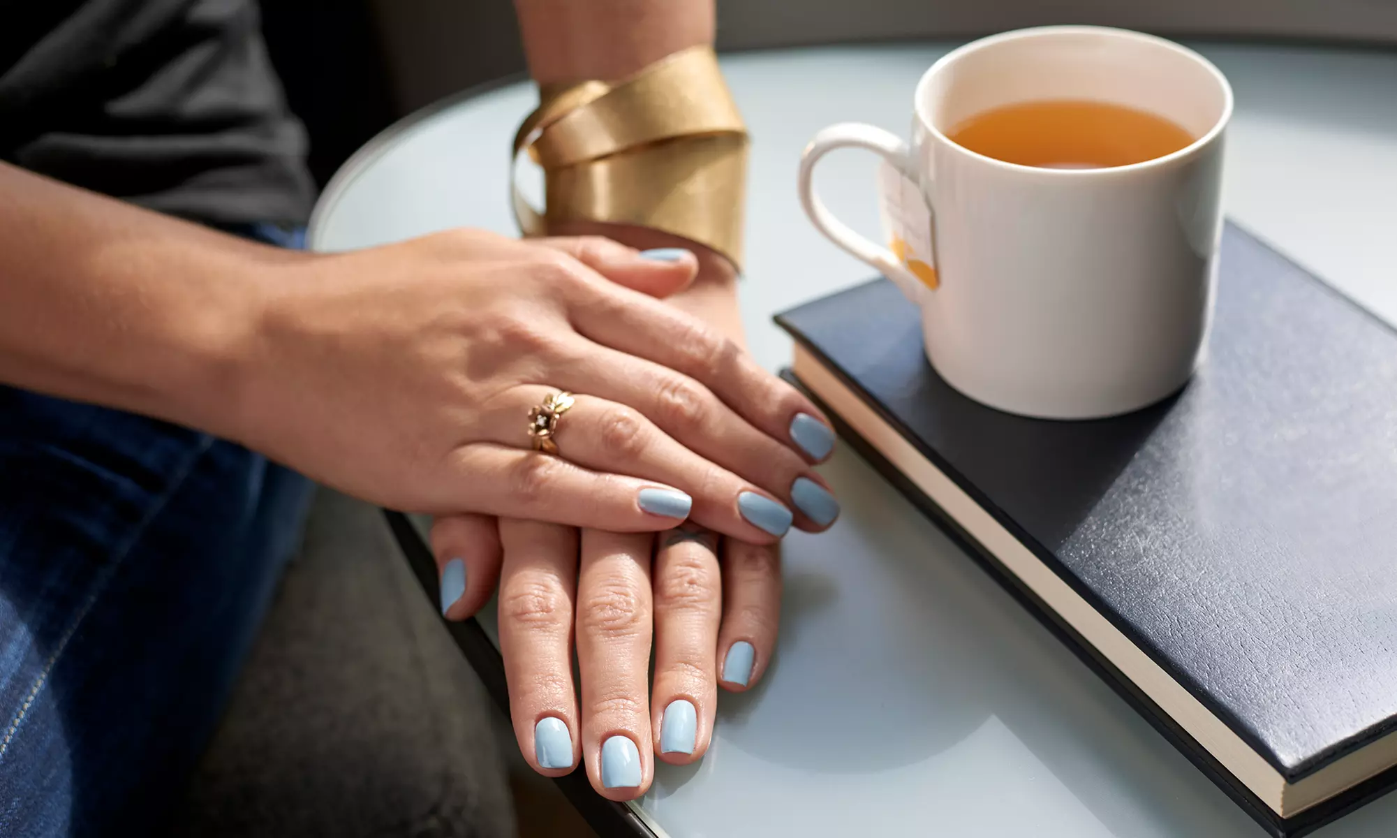 Shellac Manicure with Optional Happy Feet Pedicure at Greenwood Nail Spa (Up to 52% Off) - Primary Image