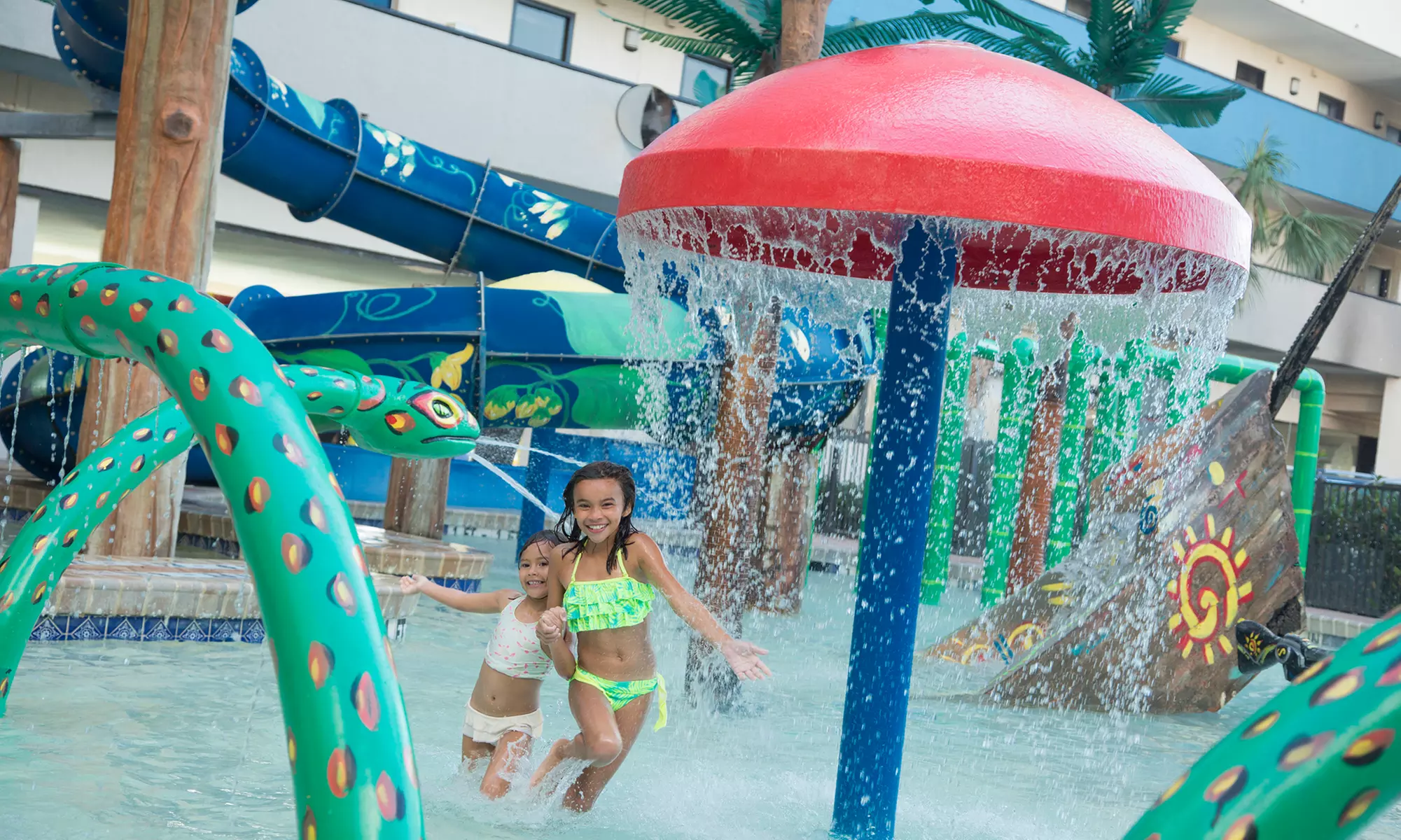 Family fun awaits at Ocean Reef Resort—pools, slides & ocean views!
