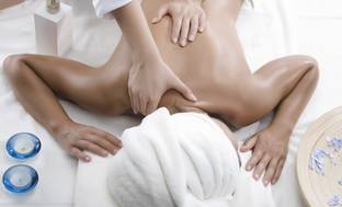 image for Therapeutic or Hot Stone Massages at The Massage Suite with Relaxation on the Go (Up to 53% Off). Four Options.