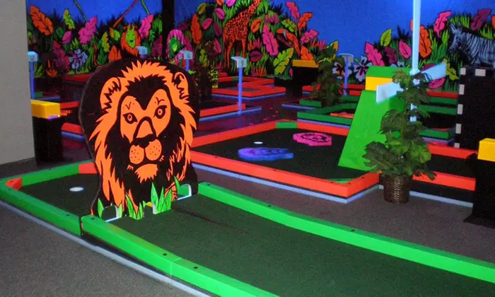 Three Rounds of Indoor Glow-in-the-Dark Mini Golf for Two, Four, or Six at Glowgolf (Up to  58%Off) - Primary Image