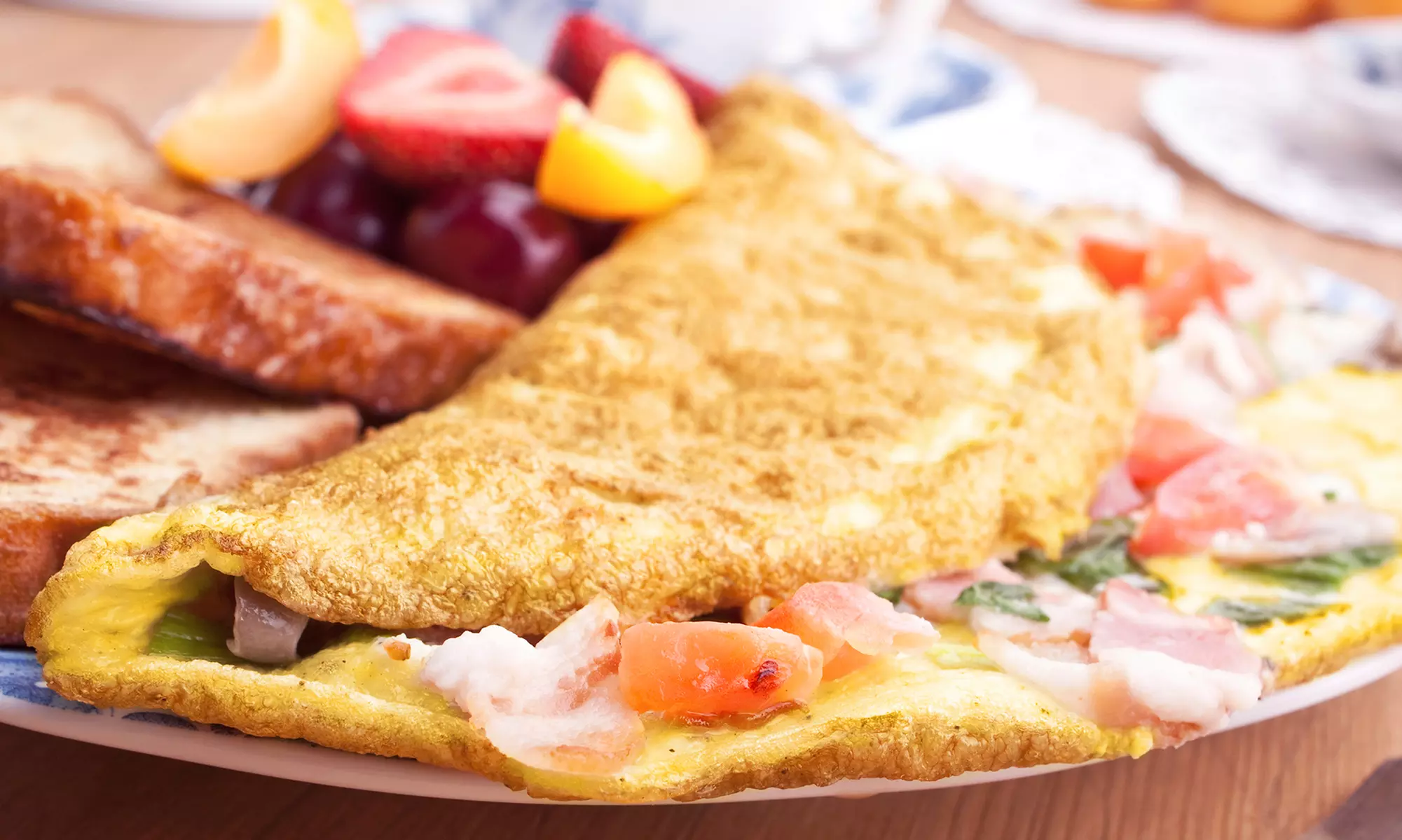 Breakfast and Lunch Cuisine at The Toasted Yolk Cafe (Up to 38% Off). Two Options Available.  - Primary Image