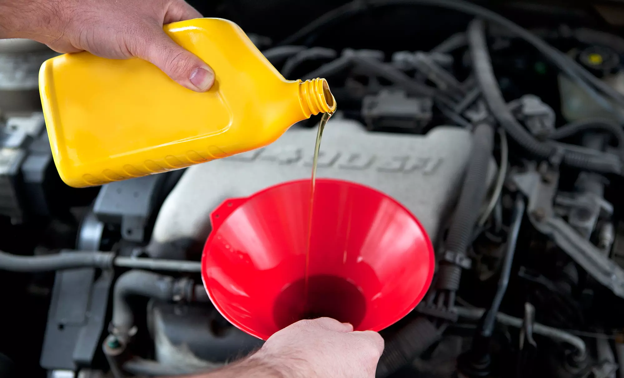 One or Three Basic or Synthetic Oil Changes at OK Tire 99th Street (Up to 91% Off) - Primary Image