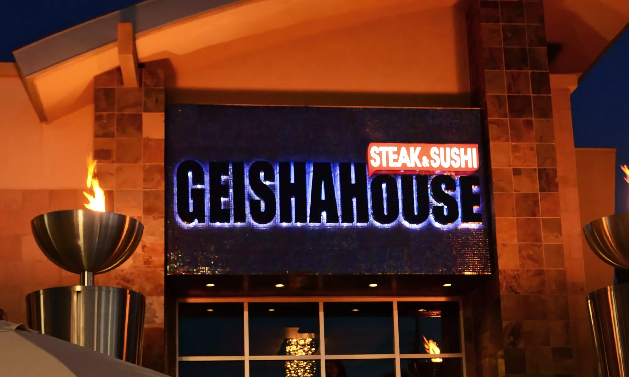 $30 for Two Sushi Rolls and One Bottle of Sake at Geisha House Steak & Sushi (Up to $49.90 Total Value) - Second Medium