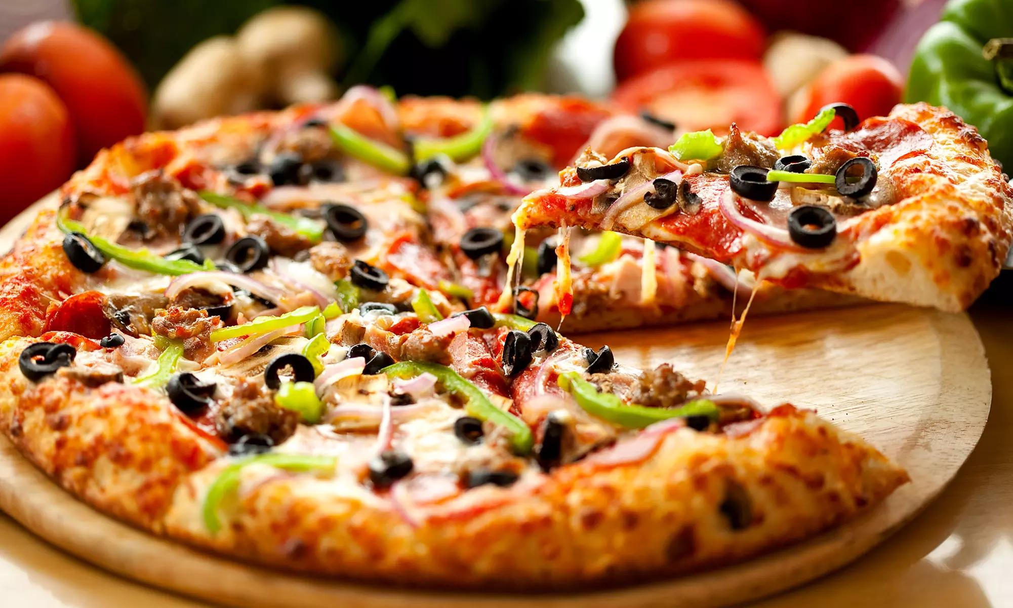 $11 for Two Groupons, Each Valid for $10 Worth of Pizza, Salads, Sides, and Drinks at Road House Pizza ($20 Value) - Primary Image
