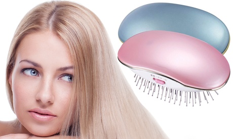 Spazzola lisciante al vapore per capelli disponibile in 2 colori rosa o azzurra funzionante a pile AAA