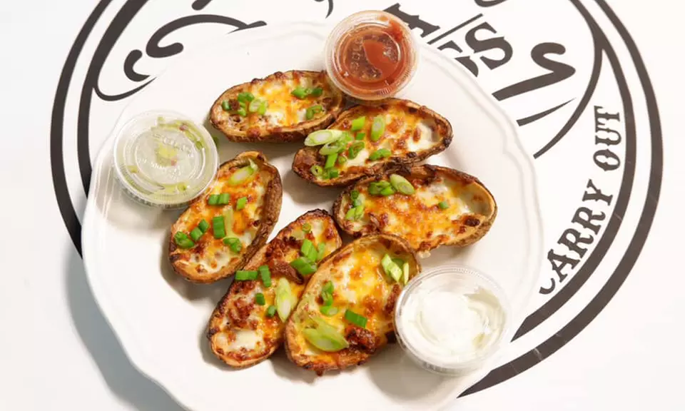 Pizza, Calzones, Wings, and More at Pizza Express (Up to 50% Off). Two Options Available. - Second Medium