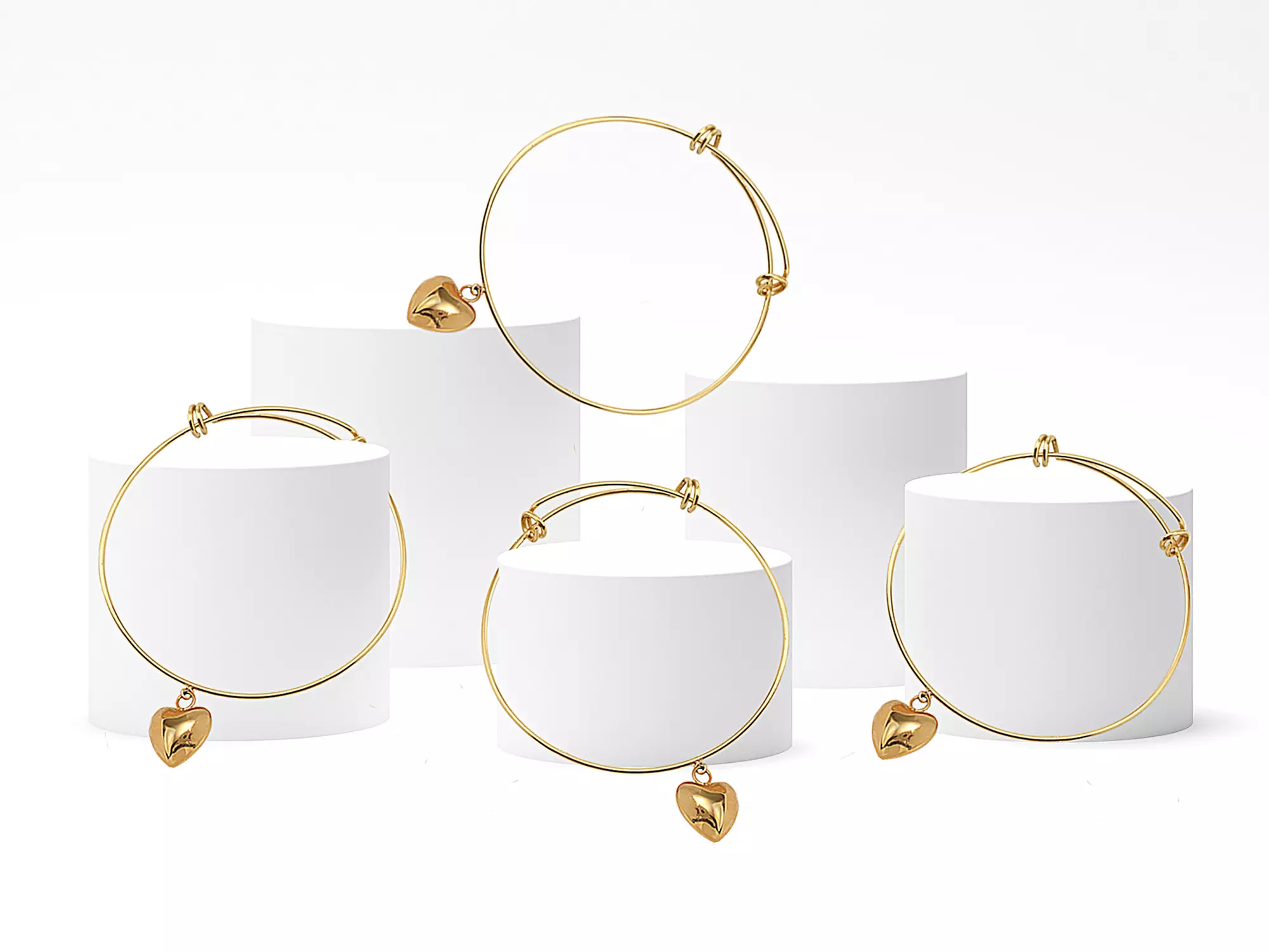 Four Adjustable Golden Bangles with Puff Heart Charm at Monogram Hub - Primary Image