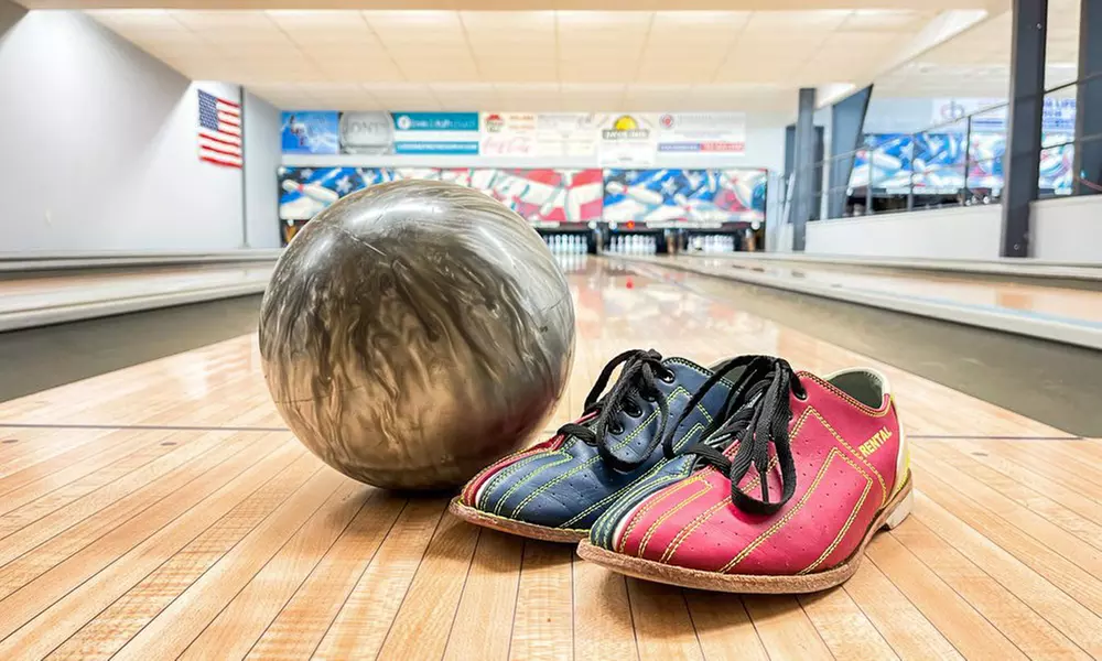 Two Games of Bowling, Shoe Rental, and Arcade Credits to Share