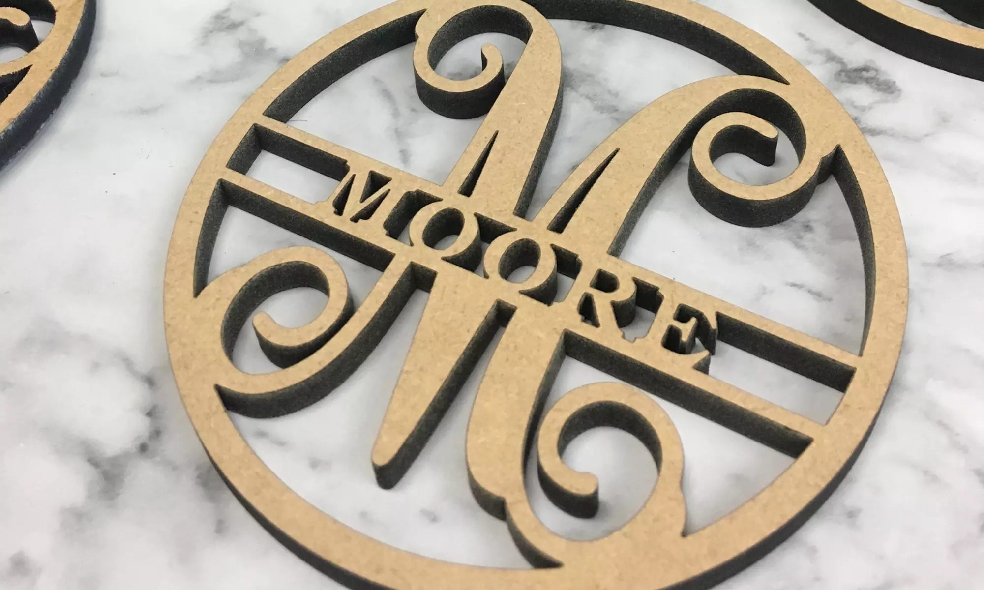 Choice of One, Two, Three, or Four Customized Family Name Wood Ornaments from Metal Unlimited (Up to 60% Off). - Primary Image