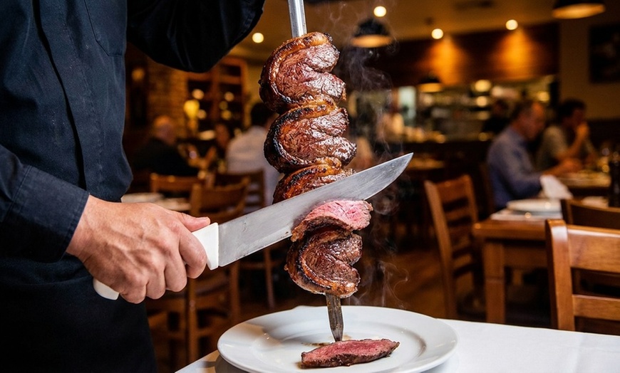 Image 2: Extensive Selection of Churrasca Meats and Bottle of Wine