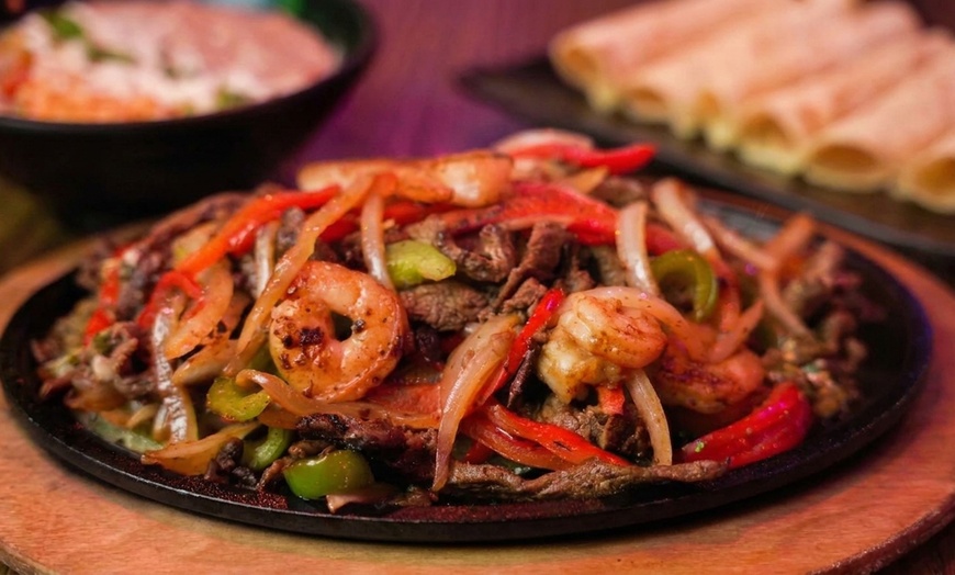 Image 15: Authentic Mexican Dining: Char-Grilled Flavors & Lively Atmosphere