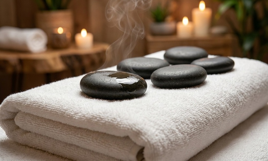 Image 7: 60-Min Foot Reflexology with Hot Stones, Essential Oil, & Foot Soak for 1 or 2 by Experts (Up To 11% Off)