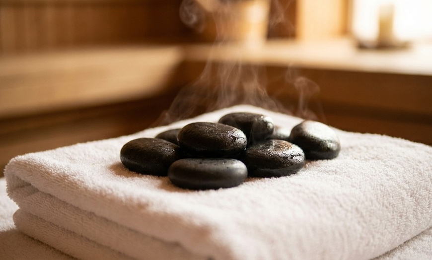 Image 6: Deluxe, Therapeutic, or Combo Body-Work Package with Essential Oil, Hot Towel, and Hot Stone Treatment. Save Up to 61%
