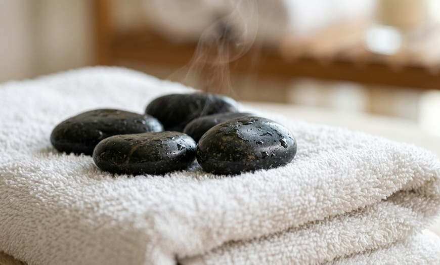 Image 7: Coconut Oil & Hot Stone Massage for Ultimate Relaxation