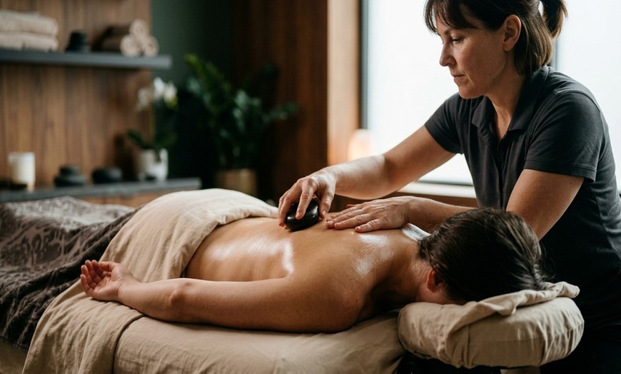 Image 5: Blissful Escape Awaits: 60 or 90-Minute Massage with Hot Stones, Cupping Therapy, and Back Scrub. Save Up to 45%