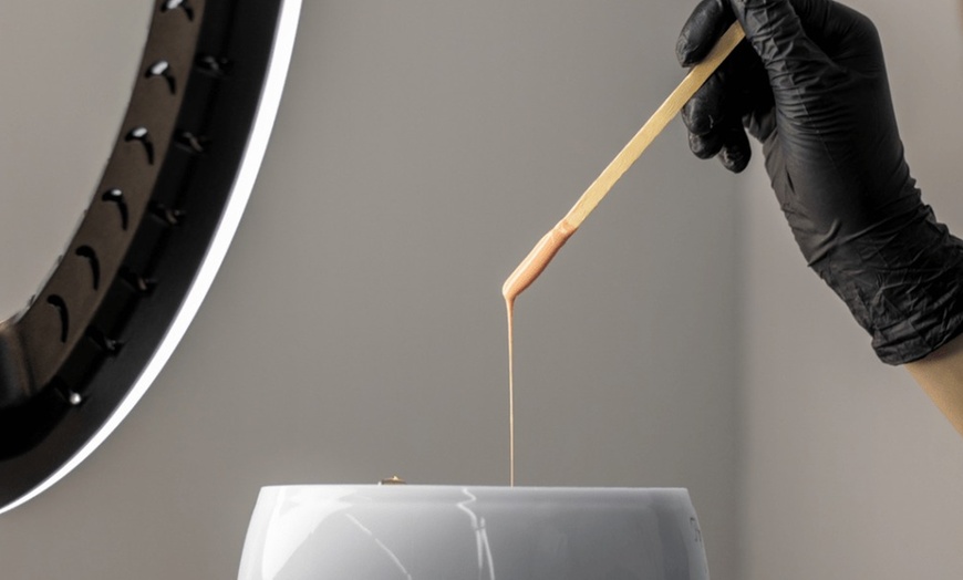 Image 3: Enjoy Butt Naked PGH's 60-minute facial with light therapy or enzyme peel, offering up to 30% off for glowing skin