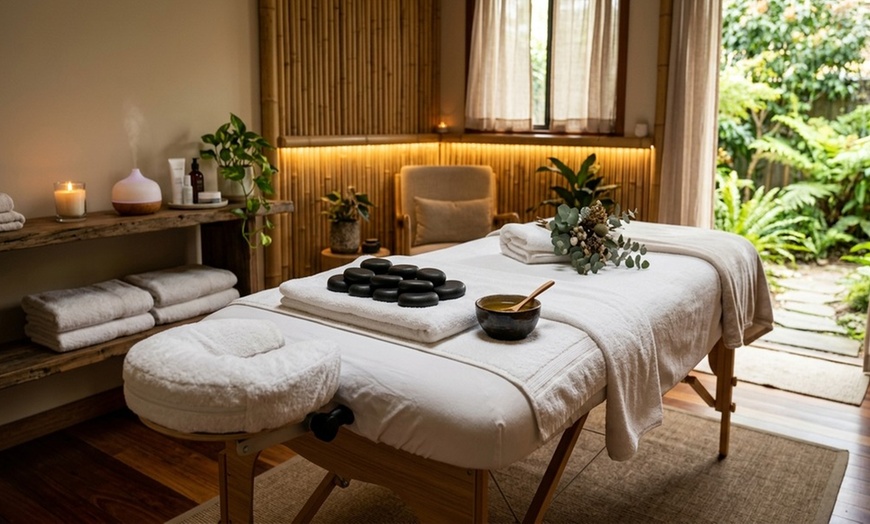 Image 2: Coconut Oil & Hot Stone Massage for Ultimate Relaxation
