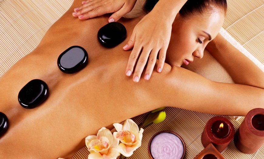 Image 8: Relax and Rejuvenate: 1-Hour Massage with Hot Stones & Foot Scrub
