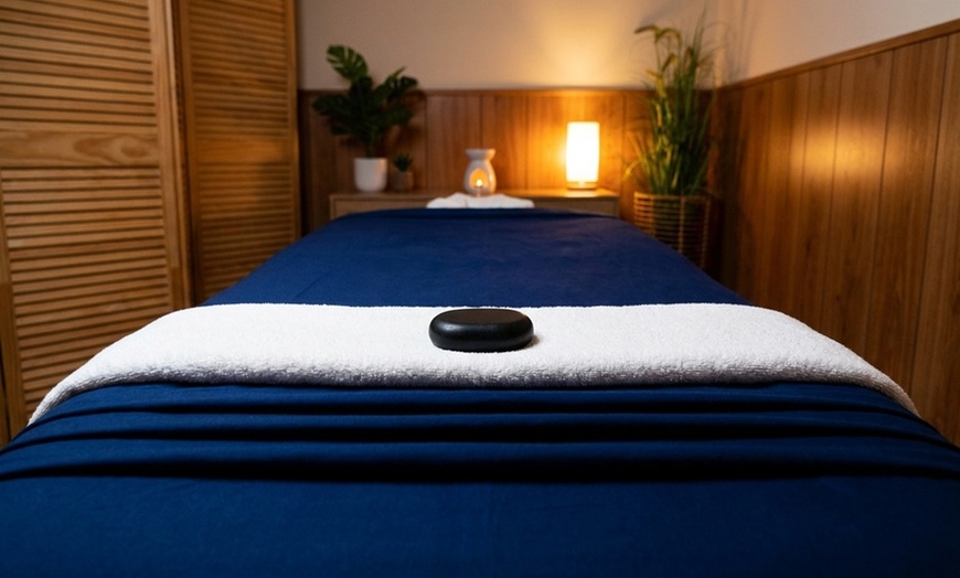 Image 8: Deluxe, Therapeutic, or Combo Body-Work Package with Essential Oil, Hot Towel, and Hot Stone Treatment. Save Up to 61%
