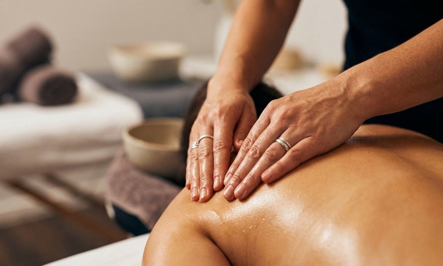 Image 7: 65-Minute Deep Tissue Massage w/ Hot Stones & Oils for One or Couple!