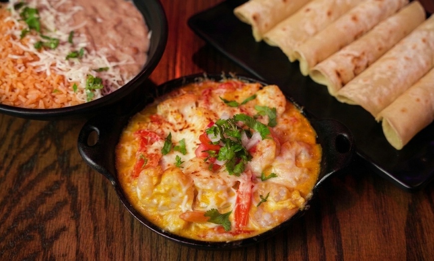 Image 13: Authentic Mexican Dining: Char-Grilled Flavors & Lively Atmosphere