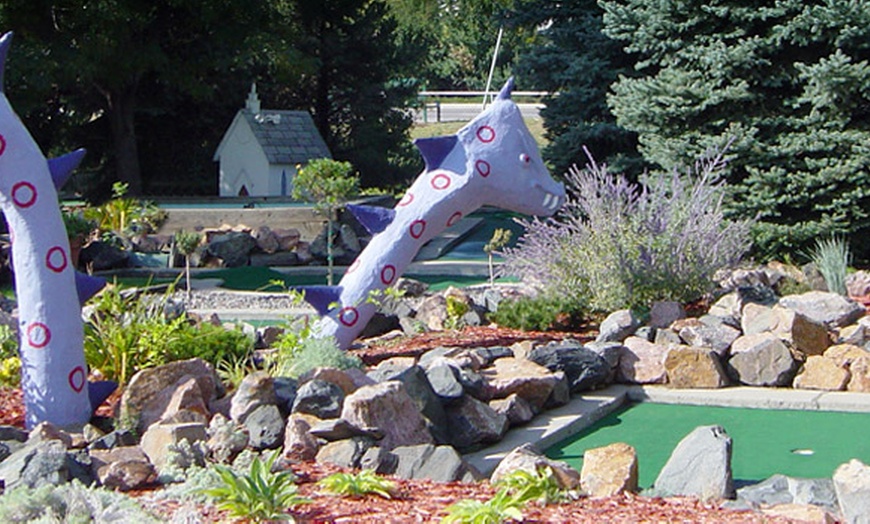 Image 3: Immerse in a Mini Golf Paradise with Whimsical Windmills and Dragons
