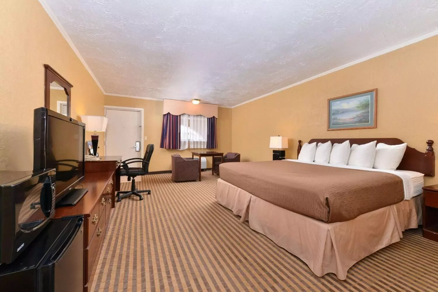 Executive Plus Inn & Suites - Primary Image