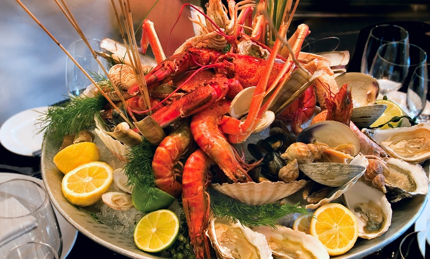 Image 1: Savor the Sea: Indulge in Premium Seafood Platter with a Water Views