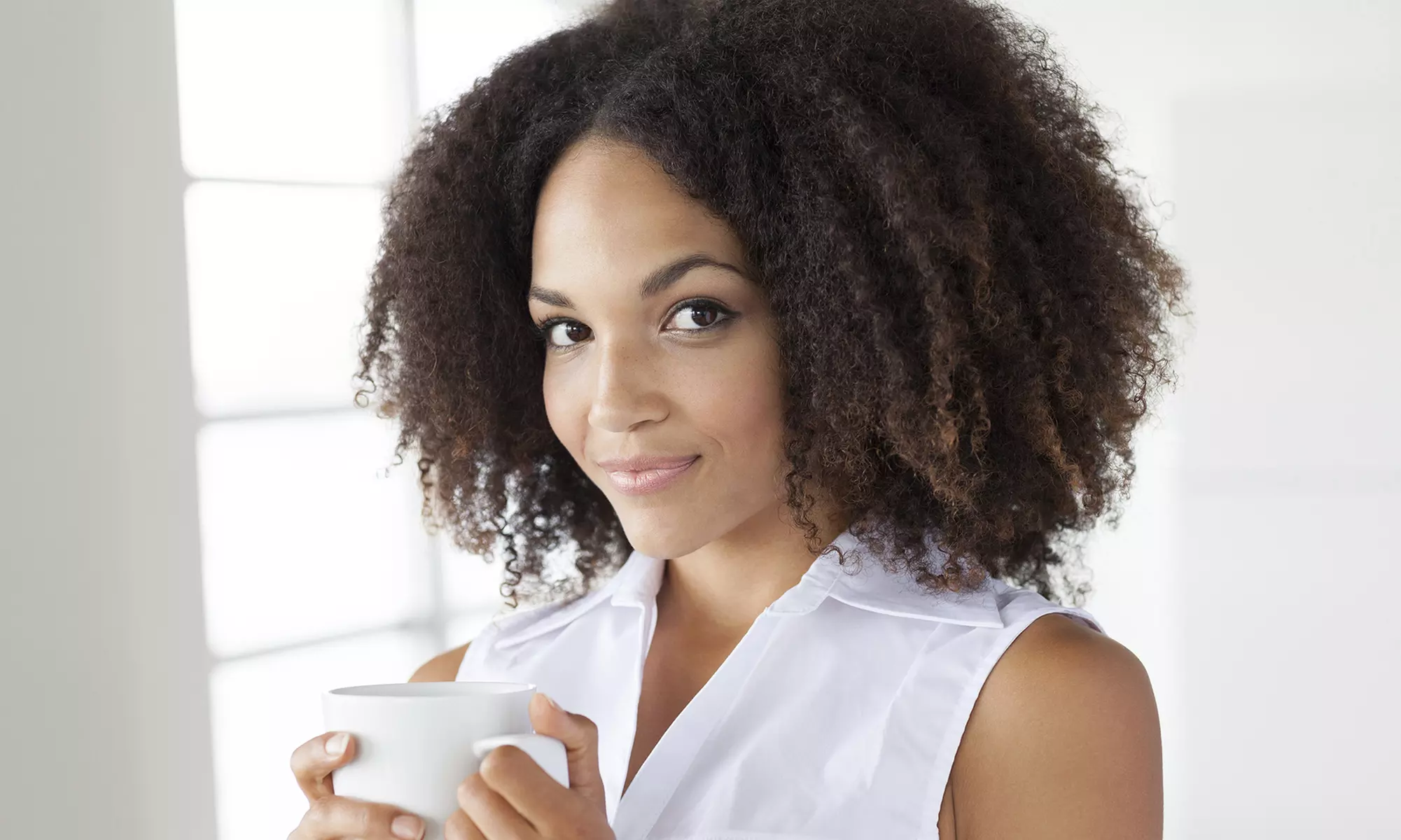 Shampoo, Conditioning, Blow Dry, and Trim with Optional Curls, Scalp Massage, or Silk Press (Up to 53% Off) - Primary Image