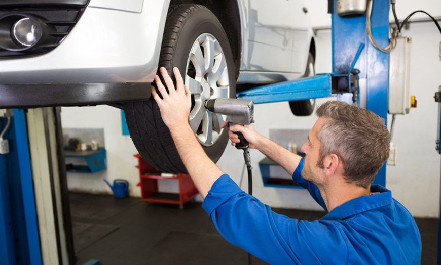 Image 1: Get Smooth Rides with Brake Pad Replacement and Tire Rotation