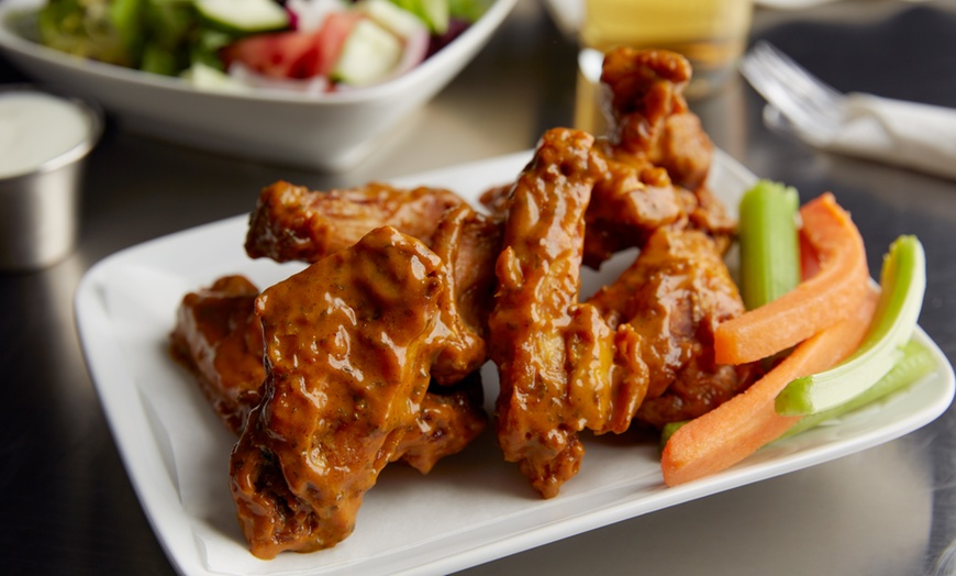 Image 1: Single Wings with a Tall Can for the Perfect Pair