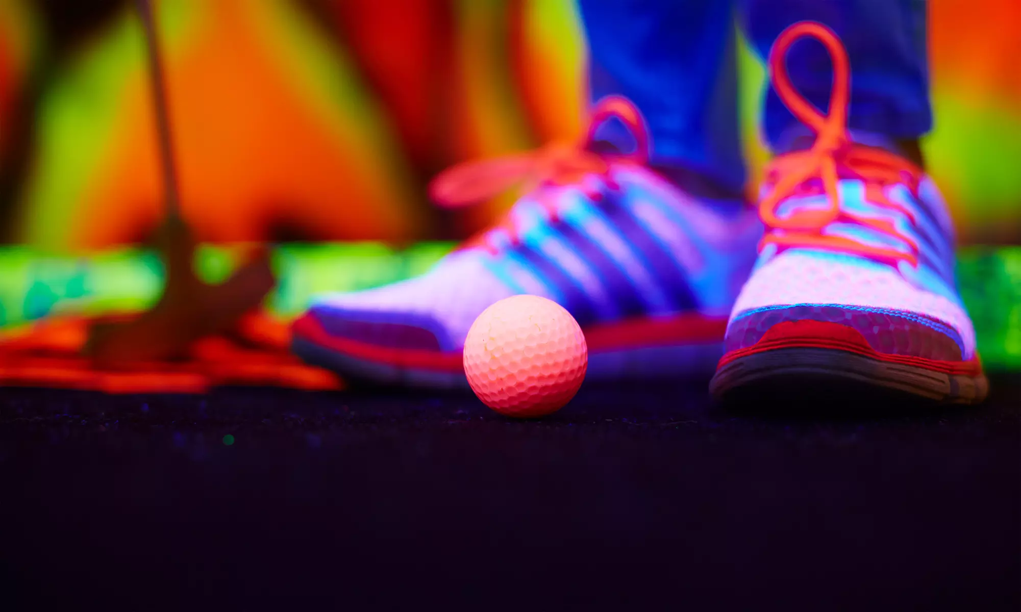 One Round of Glow-In-The-Dark Mini Golf for Two or Four at Lilli Putt ( Up to 33% Off ) - Primary Image