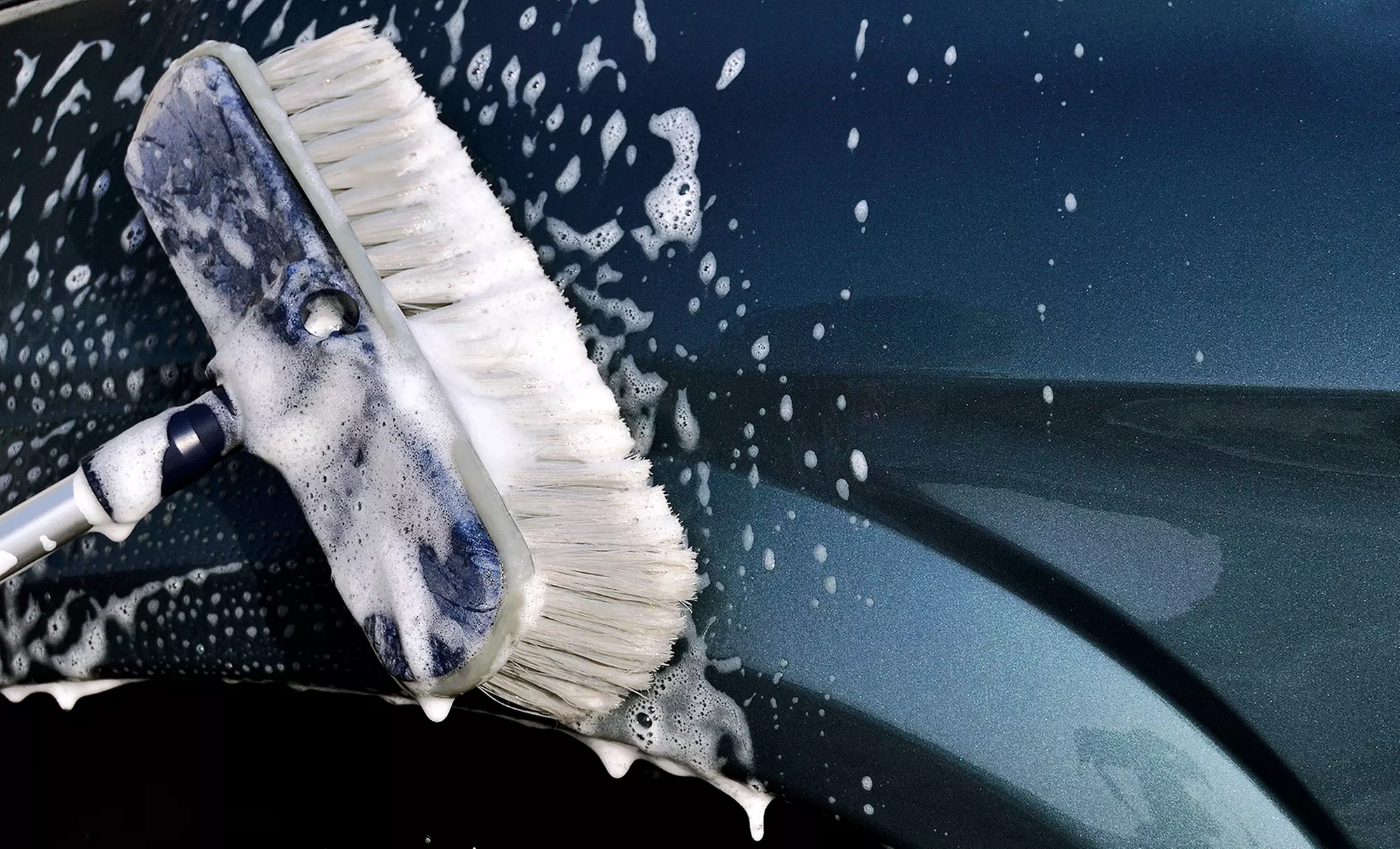 Three Groupons, Each Good for a Full-Service or Gold Car Wash at Justin's Roseville Carwash (Up to 35% Off) - Primary Image