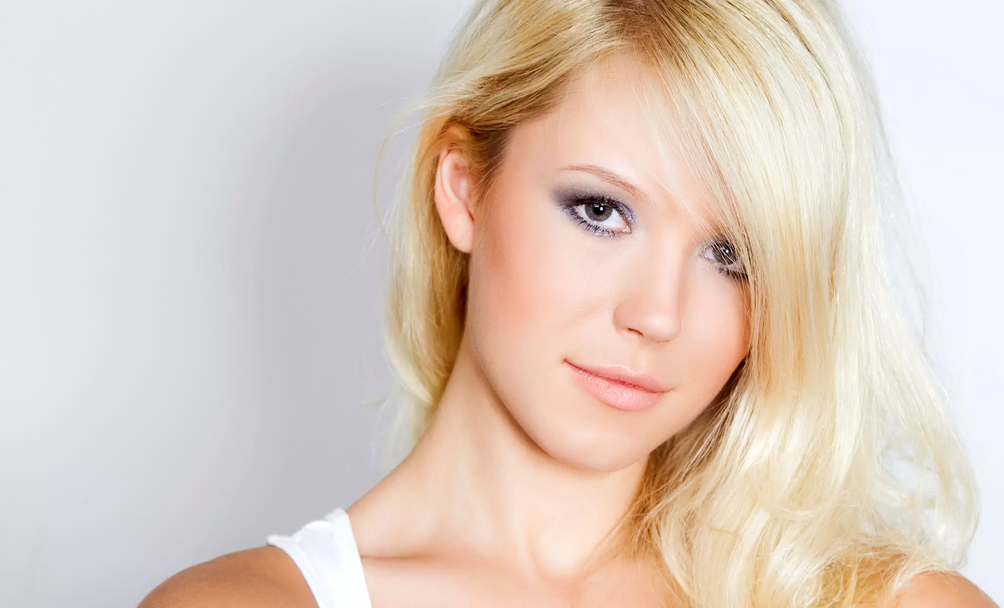 Haircut with Optional Blowout and Highlights at Sharp Image (46% Off) - Primary Image
