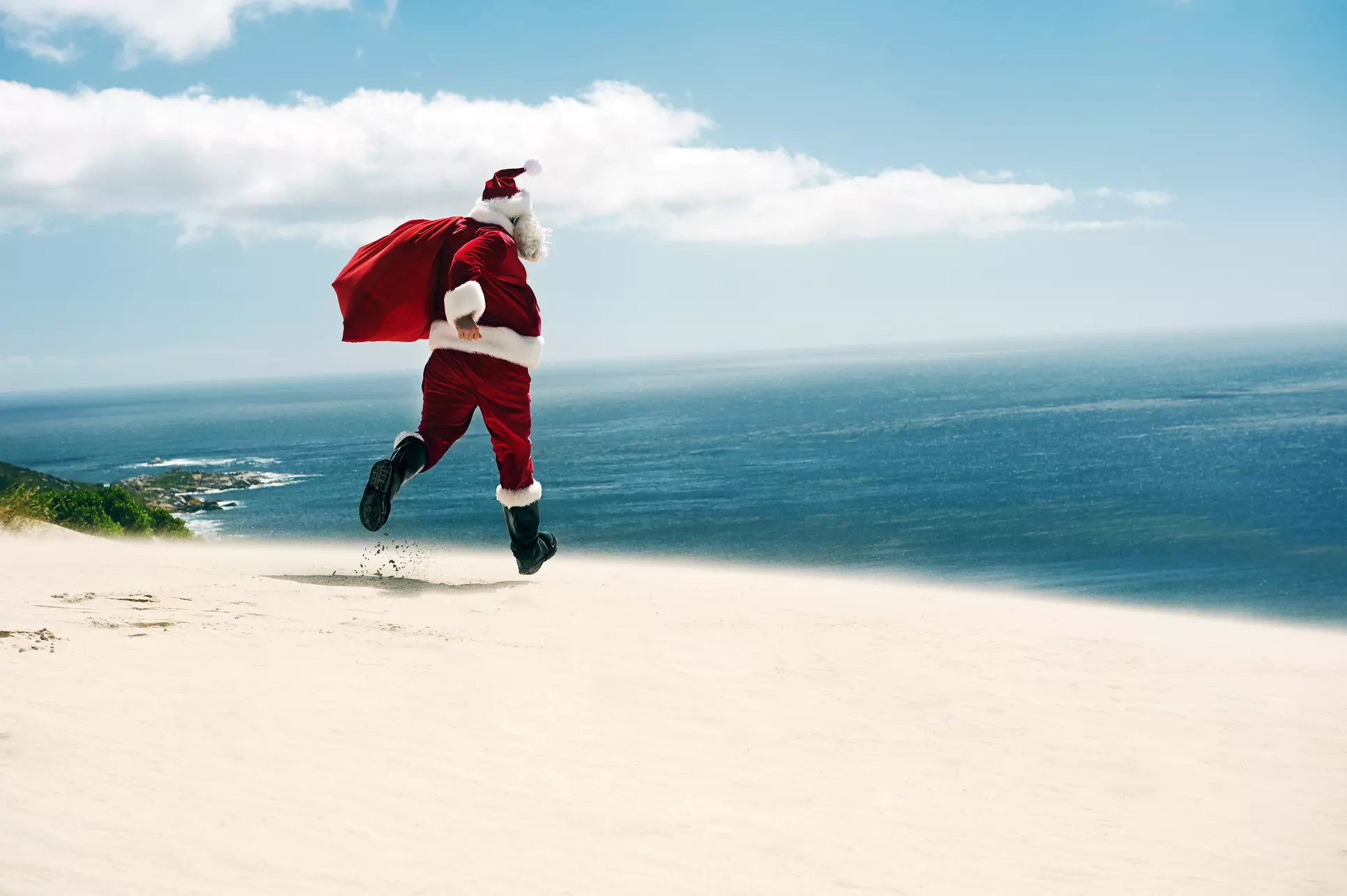 Festive Holiday Memories — Santa on the Beach Photo Experience by Emerald Coast Captures (Up to 75% Off) - Primary Image