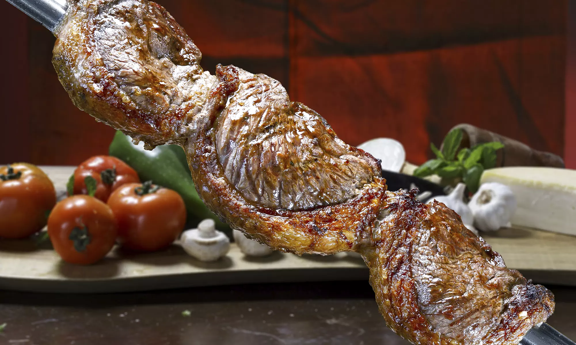 Brazilian Steakhouse Dinner for Two or Four at Blue Charcoal (41% Off) - Primary Image