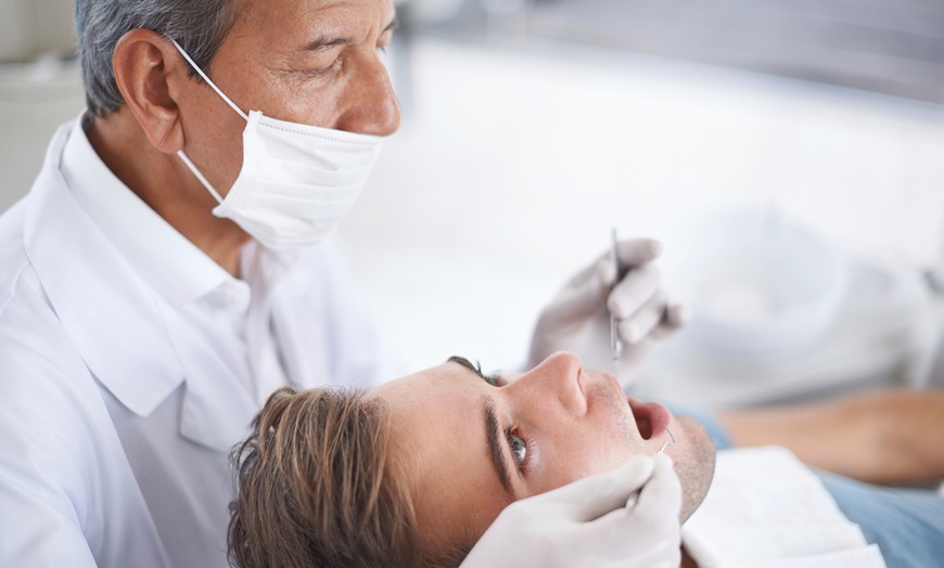 Image 1: 75% Off Full-Mouth Deep Cleaning at Design Dental Spa