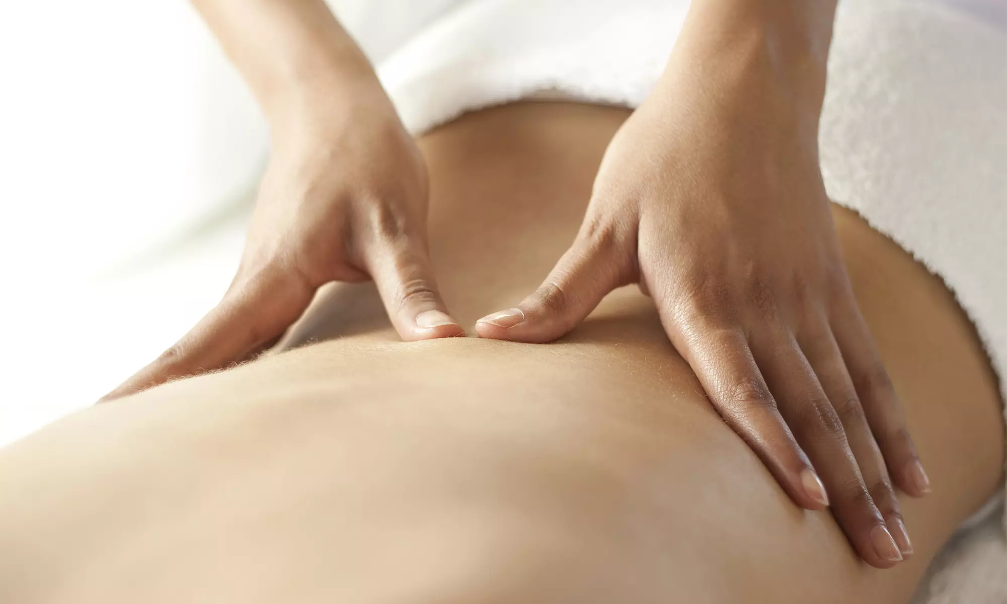 Relax & Unwind w/ Swedish, Deep‑Tissue, Hot Stone, Cupping or Combination Massage at (Up to 50% Off) - Primary Image
