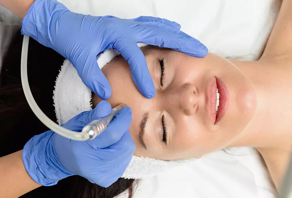 Iluxe Beauty offers a revitalizing skin experience with microdermabrasion, microcurrent & LED therapy facial up to 50% off - Primary Image