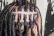 Up to 33% Off Revitalize Your Look with Loc Retwist or Silk Press Services - Zhanés Hair fortress - Second Medium