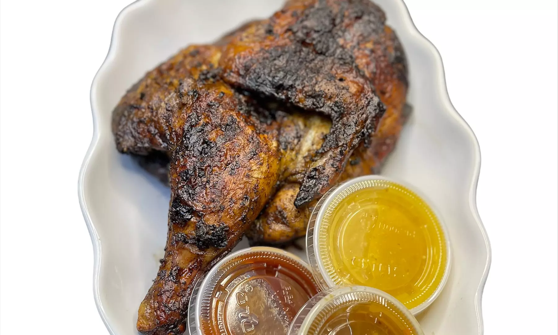 Up to 33% Off on Jamaican Cuisine at Tropics Jerk Center - Primary Image