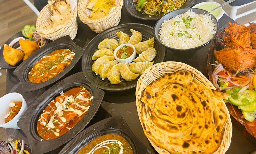 Image 1: Up to 35% Off on Vegetarian Restaurant / Cuisine at Tandoori Chops Indian Grill and Bar