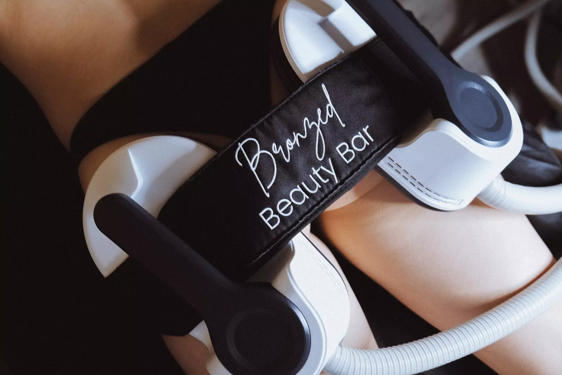 Discover Bronzed Beauty Bar's EmSculpt Neo sessions, sculpting arms, buttocks, or abs with up to 50% off
