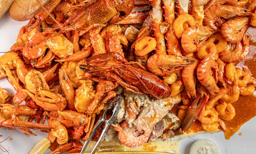 Image 1: Up to 33% Off on Seafood Restaurant at St James Crabhouse Bar and Grill