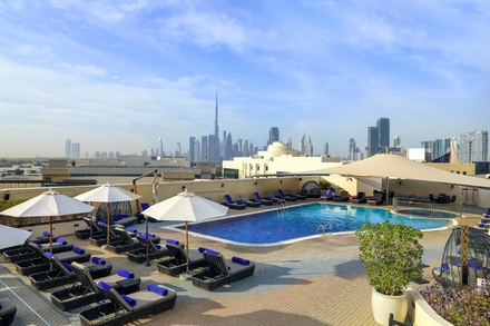 One child: five-star rooftop pool access with AED 39 toward food; valid for children up to 12 years old